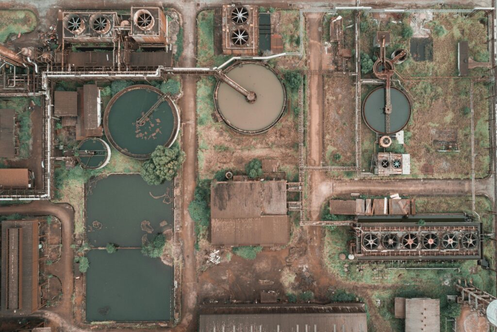 Amazing drone view of huge area of modern wastewater treatment plant with tanks of dirty and clean water